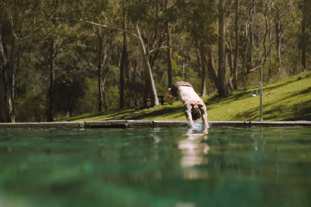 Diving into the thermal pool at Yarrangobilly Caves, around an hour from Tumut in the Snowy Valleys, NSW